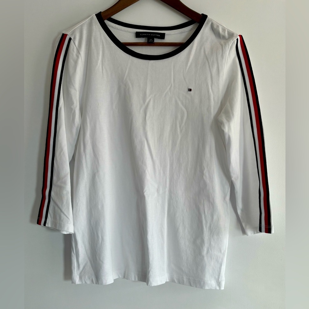 3/4 sleeve white shirt with blue along collar & red/blue stripes along sleeve